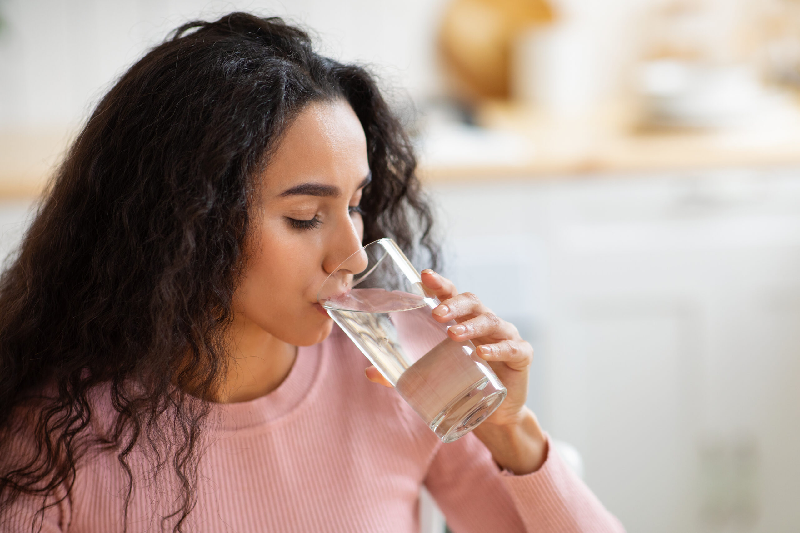 Image of woman drinking water.