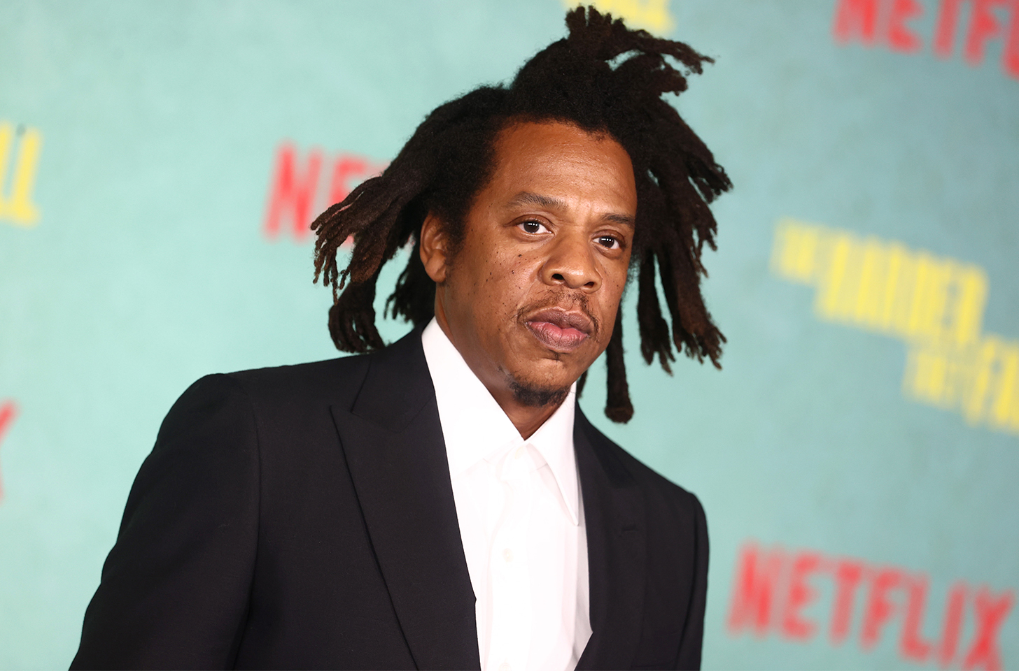 Jay-Z in a suit at the Harder They Fall premiere