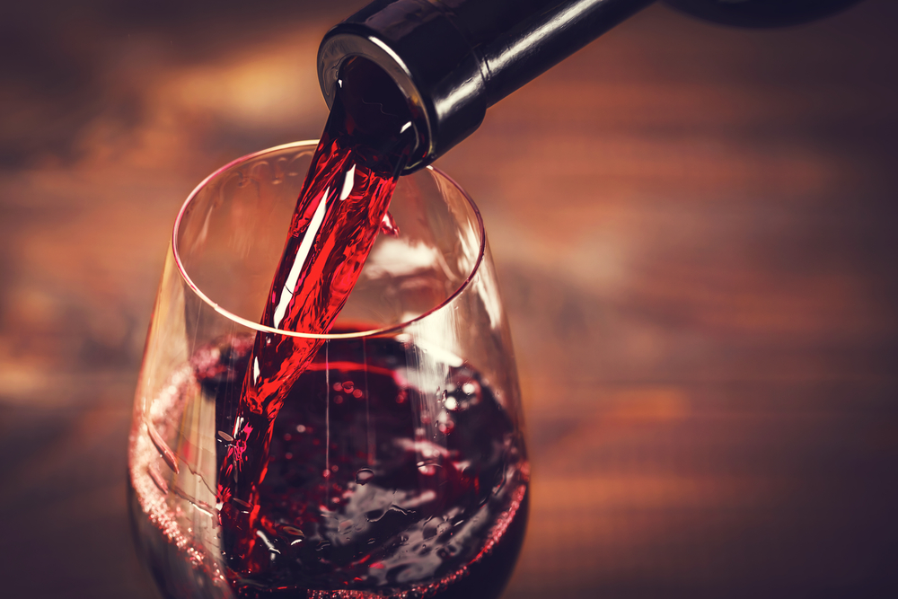 Pouring red wine into a glass