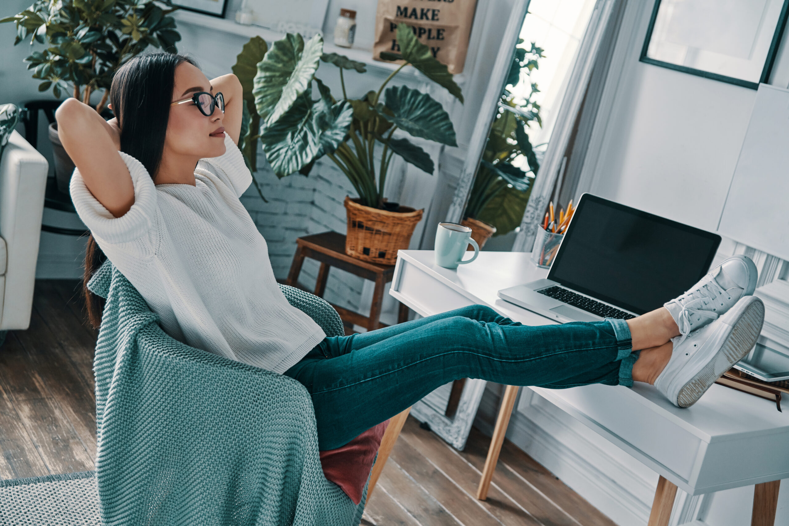 Young woman relaxing in home office