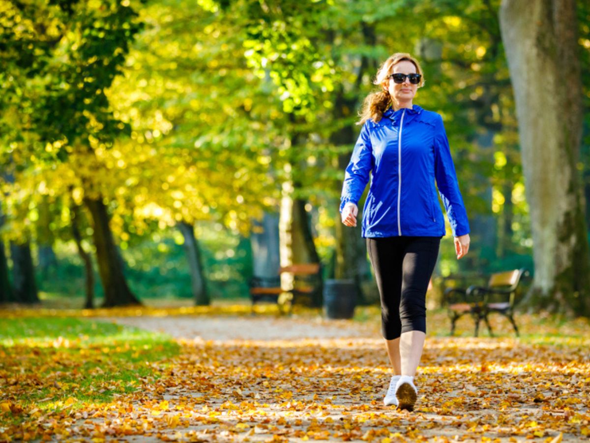 Woman walking outdoors during fall