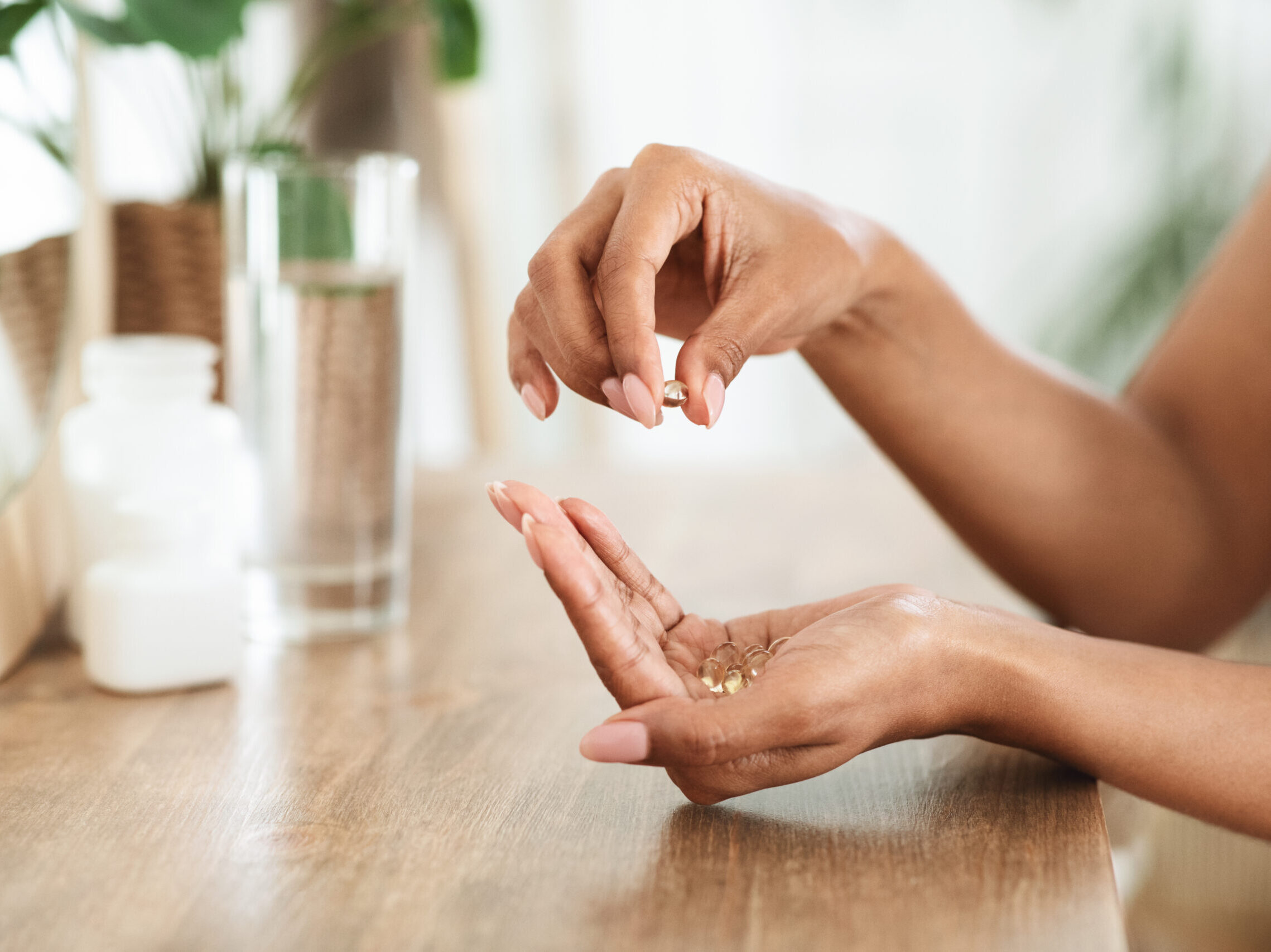 A woman's hands holding supplements