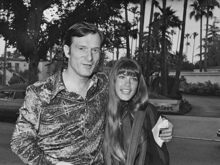 Hugh Hefner (L) with Barbi Benton in black and white image from 1971