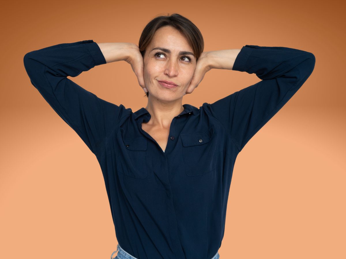 A woman smirking and looking confident