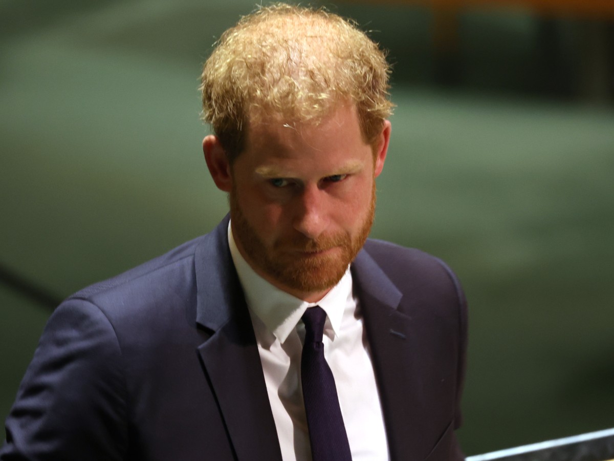 Prince Harry in navy blue suit and tie