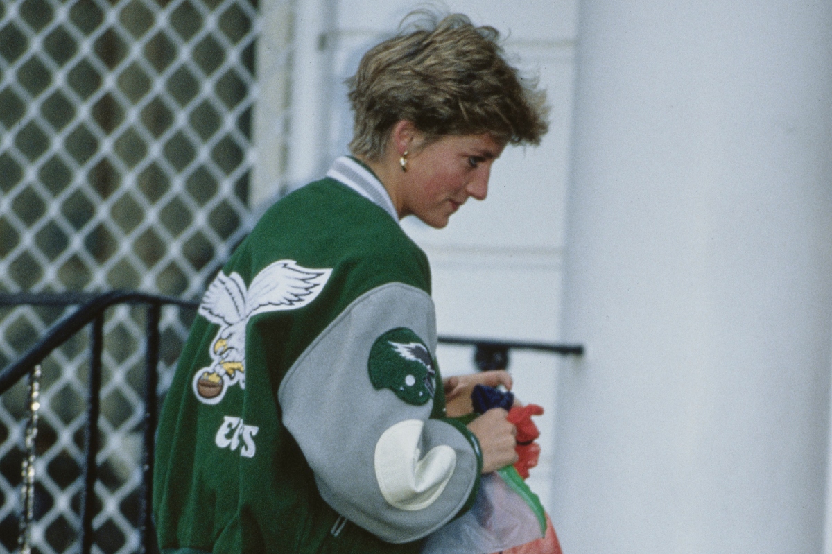 Diana, Princess of Wales (1961 - 1997) wearing a Philadelphia Eagles jacket to drop off her son Prince Harry at Wetherby School in London, January 1991. Prince William is accompanying them. (Photo by Jayne Fincher/Princess Diana Archive/Getty Images)
