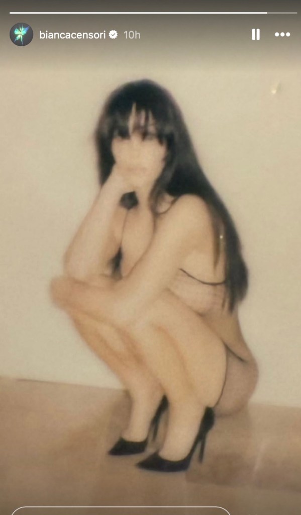 bianca-censori-rocks-sheer-fishnet-dress-and-long-hair-in-new-photo
