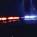 Police Car Flashing Lights At Crime Scene